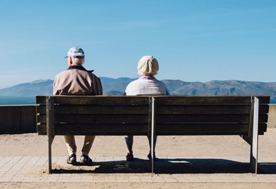 This image has an empty alt attribute; its file name is Elderly-couple-on-park-bench.-Photo-by-Matthew-Bennett-on-Unsplash-Cropped-398x272-1.jpg